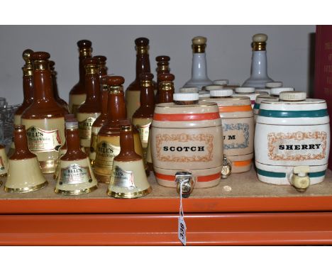 A GROUP OF THIRTY-ONE DECANTERS to include nine Wade decanters comprising three sherry, two scotch, one Rum, one Port, two Gi