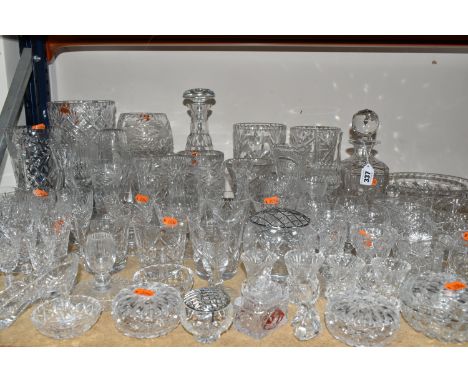 A LARGE GROUP OF CRYSTAL CUT GLASSWARE to include assorted glasses, two decanters, approximately seven vases, a quantity of t