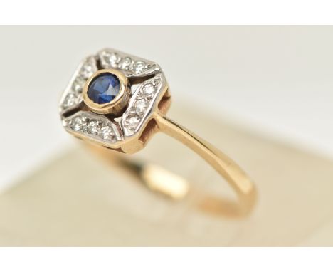 A 9CT GOLD SAPPHIRE AND DIAMOND RING, designed as a central circular cut sapphire within a brilliant cut diamond surround wit