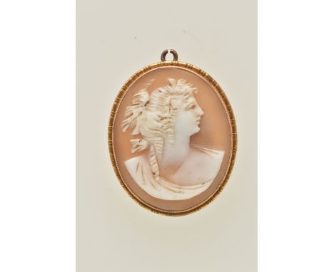 A CAMEO PENDANT, the oval cameo depicting a female in profile within a millegrain setting, reverse stamped 9ct, approximate l
