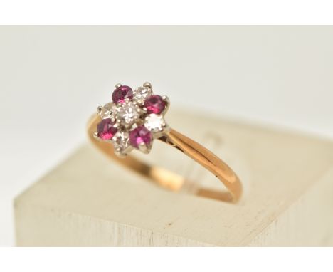 A RUBY AND DIAMOND RING, designed as a central brilliant cut diamond within a single cut diamond and circular shape ruby surr
