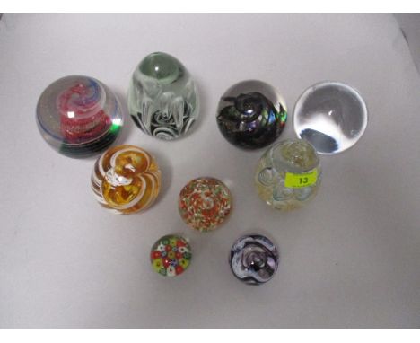 A collection of paperweights including Caithness and millefiori.
