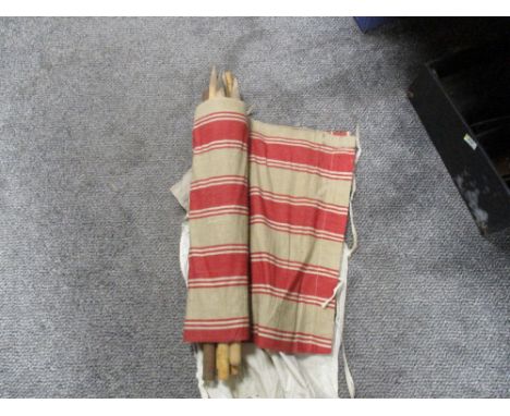 A Vintage Mid Century striped material wind breaker, with poles and carry bag