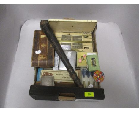 A selection of vintage curios and trinkets including card games, cigarette cases and a police style baton etc