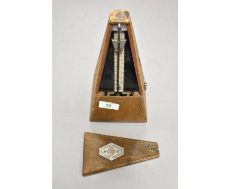 An antique Paquet musicians metronome