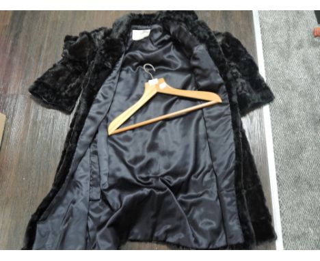 A selection of vintage ladies fur jackets including full length sheep skin