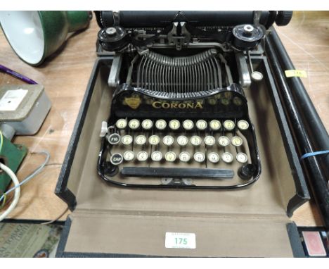 An early 20th century Corona typewriter no.3 with case and accessories