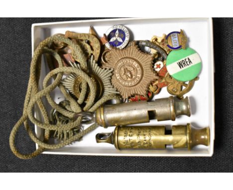 Two whistles one marked with military foot 1943 and other Metropolitain, also Cheshire cap badges and enamel pins