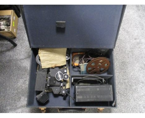 A 1930's cased Pathescope 200-B 9.5mm projector, housed within a material covered wooden case, with some other components and