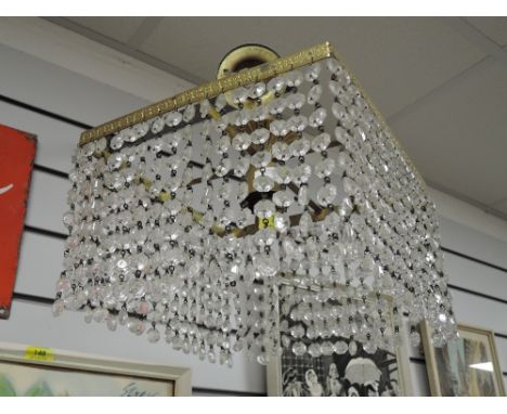 A vintage brass framed and lustre droplet ceiling light pendant