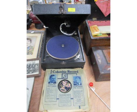 An early 20th century Columbia gramophone record player with a selection of 78rpm records