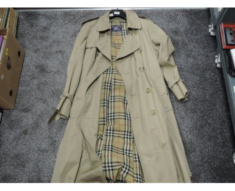 A vintage Burberry trench coat
48R, gents coat, slight storage marks one or two small spots to lining, no notable damage.