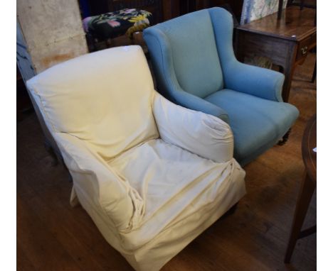 A late 19th/early 20th century wing back armchair, on turned front legs, with light blue upholstery, and another similar (2) 