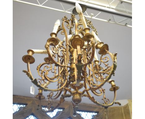 A gilt brass twelve light chandelier, fitted for electricity (needs re-wiring), 74 cm wide 