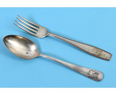 An Adolf Hitler formal pattern silver coloured metal dessert fork, with a Greek key border and traditional eagle and swastika