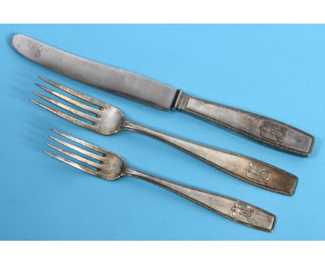 An Adolf Hitler formal pattern silver coloured metal table knife, with a steel blade, with a matching table fork and dessert 