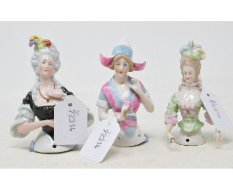 A porcelain half doll, Marie Antoinette, based on the portrait by Vigée Le Brun, 10.5 cm high, and two others (3) 