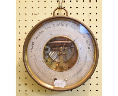 A Holosteric Barometer, with Fahrenheit and Reaumur thermometers, in a brass case, 21 cm diameterCurrent numerical reading is