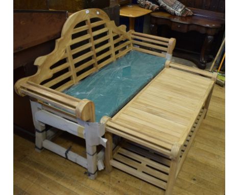 A Lutyens style teak garden bench, a pair of teak garden armchairs and a teak garden coffee table (4) 