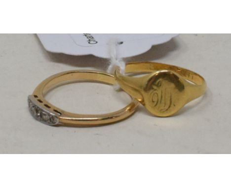 An 18ct gold signet ring, and an 18ct gold and five stone diamond ring, approx. 5.7 g (all in) (2) 