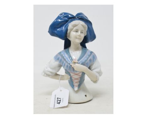 A Goebel porcelain half doll, wearing Alsace national costume, impressed marks to back, 15.5 cm high 