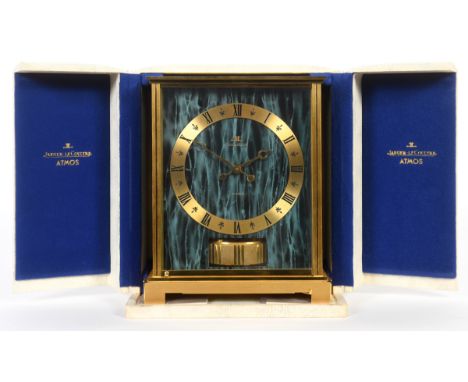 A Jaeger-Le Coultre Atmos Embassy clock, with a green marbled effect dial and Roman numerals, in a brass case, 21.5 cm high, 