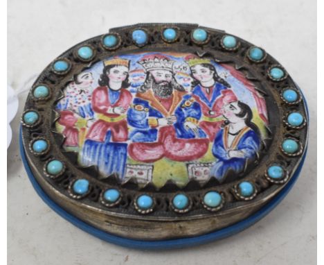 An oval silver coloured metal filigree box, the cover inset an oval enamel panel within a surround of turquoise, 6.5 cm wideR