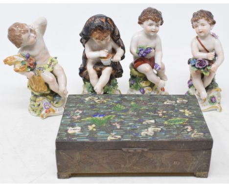A set of four Capodimonte putto, the four seasons, and a Japanese antimony and enamel box, decorated birds and flowers 