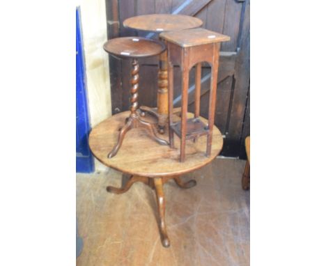 An oak low tripod table, 77 cm diameter, two wine tables and a jardiniere stand (4) 