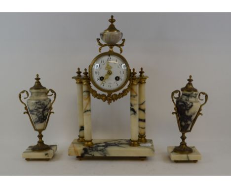 A Louis XVI style clock garniture, the clock with an 8.5 cm diameter enamel dial with Arabic numerals and decorated swags, fi