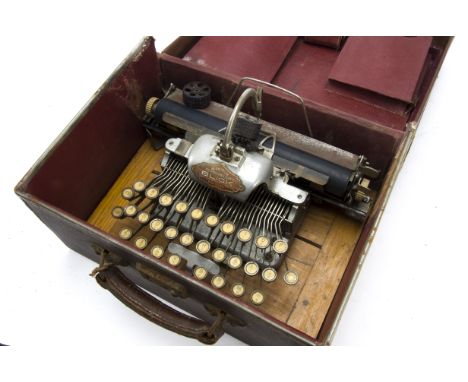 A Blick typewriter, Aluminium featherweight model, with two type-wheels and instructions, in cloth-covered case 