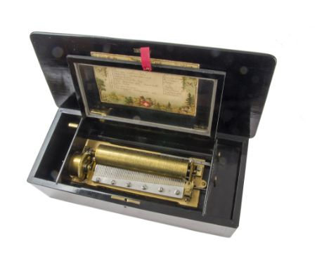 A musical box, playing eight airs including Iolanthe, listed on 'Isle Rousseau' tune-sheet, in grained case with inlaid lid -