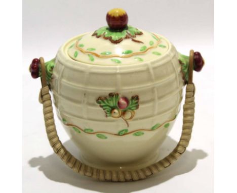 1930s biscuit barrel made by Wilkinson in the style of Clarice Cliff, the biscuit barrel with wicker handle and acorn knop, 1