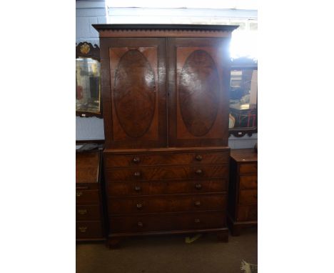 19th century mahogany and satinwood inlaid secretaire linen press with two panelled doors with oval inlaid detail with fitted