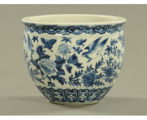 A Chinese Kangxi blue and white bowl, decorated with birds, butterflies and foliage and with four character mark to base.  Di