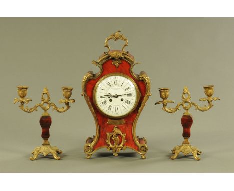 A faux tortoiseshell and brass mounted clock garniture, bearing plaque dated 1917, marked to the ceramic dial Hamilton &amp; 