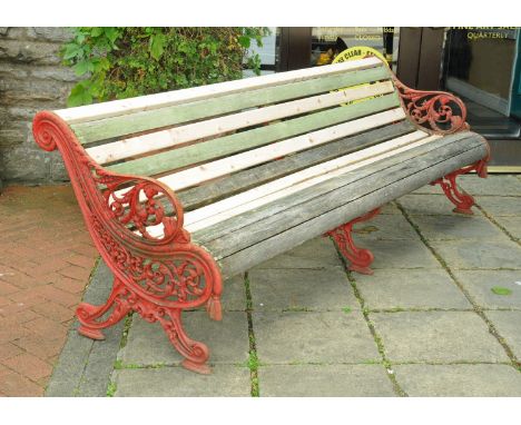 A large Victorian Falkirk garden bench, with three cast iron supports and slatted seat.  Length 240 cm. CONDITION REPORT: The