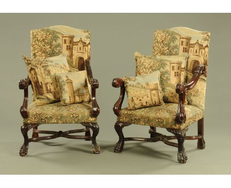 A pair of large throne type armchairs, the backs and seat upholstered in woolwork tapestry and raised on cabriole legs termin