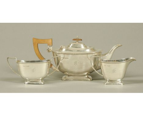 A three piece silver tea service, Fenton Brothers Glasgow, with Sheffield Hallmark for 1936.  1001 grams gross (see illustrat