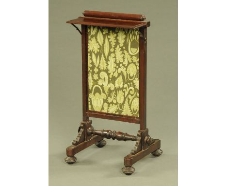 A William IV mahogany framed fire screen, with rise and fall action.  Width 43 cm.