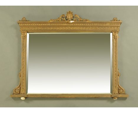 A 19th century giltwood and gesso rectangular overmantle mirror, with bevelled glass and raised on ceramic bun feet.  Height 
