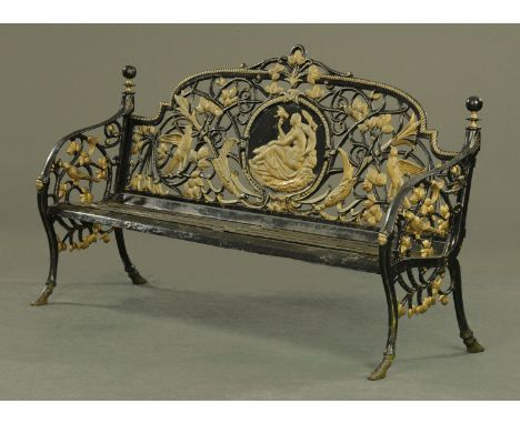 A Victorian style cast iron garden bench, with pierced cast back and slatted seat.  Length 184 cm, height to top of back 108 