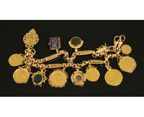 A heavy 9 ct gold charm bracelet, manufactured from an Albert chain and complete with 1787 guinea, 3 sovereigns (1900, 1911 a