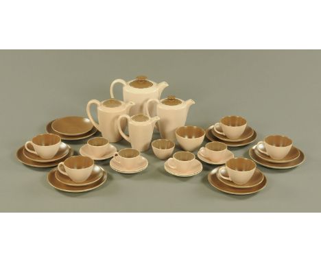 A Poole pottery part tea and coffee service, comprising coffee pot, water jugs and milk jug, 6 side plates, 5 tea cups and 6 