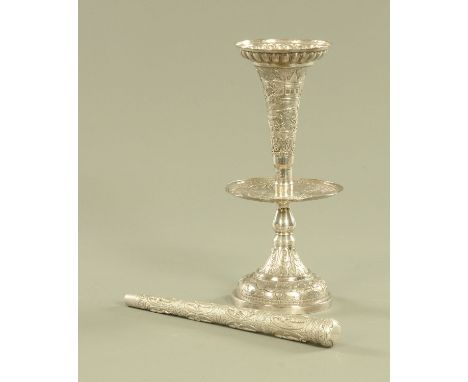 An Eastern silver coloured metal single flute epergne, with conical foot repousse with palm trees, buildings and animals, hei