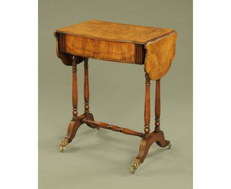 A walnut veneered and mahogany crossbanded small sofa table, with lift up top to maple lined compartment, with bowfront and r