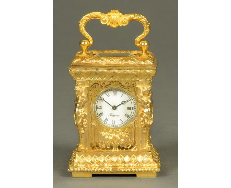 A miniature carriage clock, in the Rococo style, with caryatid figures to each corner.  Height excluding carrying handle 73 m