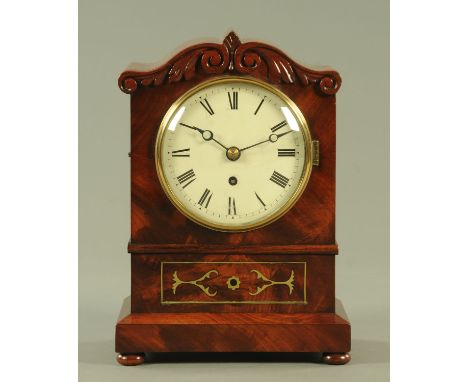 A Regency mahogany and brass inlaid single fusee clock, the enamel dial with Roman numerals, with single-train fusee movement