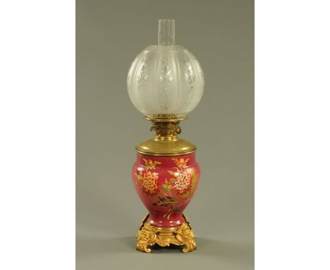 A 19th century brass and porcelain oil lamp, with etched and cut glass shade.  Height including chimney 59 cm. CONDITION REPO