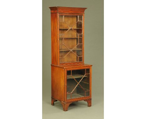 An Edwardian inlaid mahogany side cabinet, in two sections, both glazed and raised on bracket feet.  Width 64 cm, height 177 